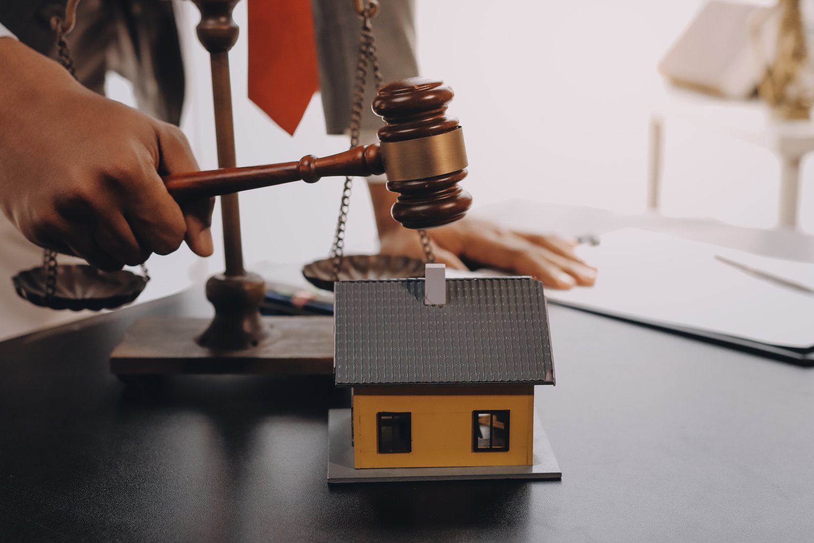 Realtor reviewing power of attorney documents for a property sale with a client