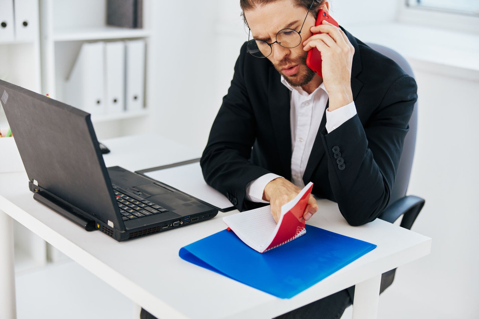 Real estate agent comparing cold calling and cold emailing strategies