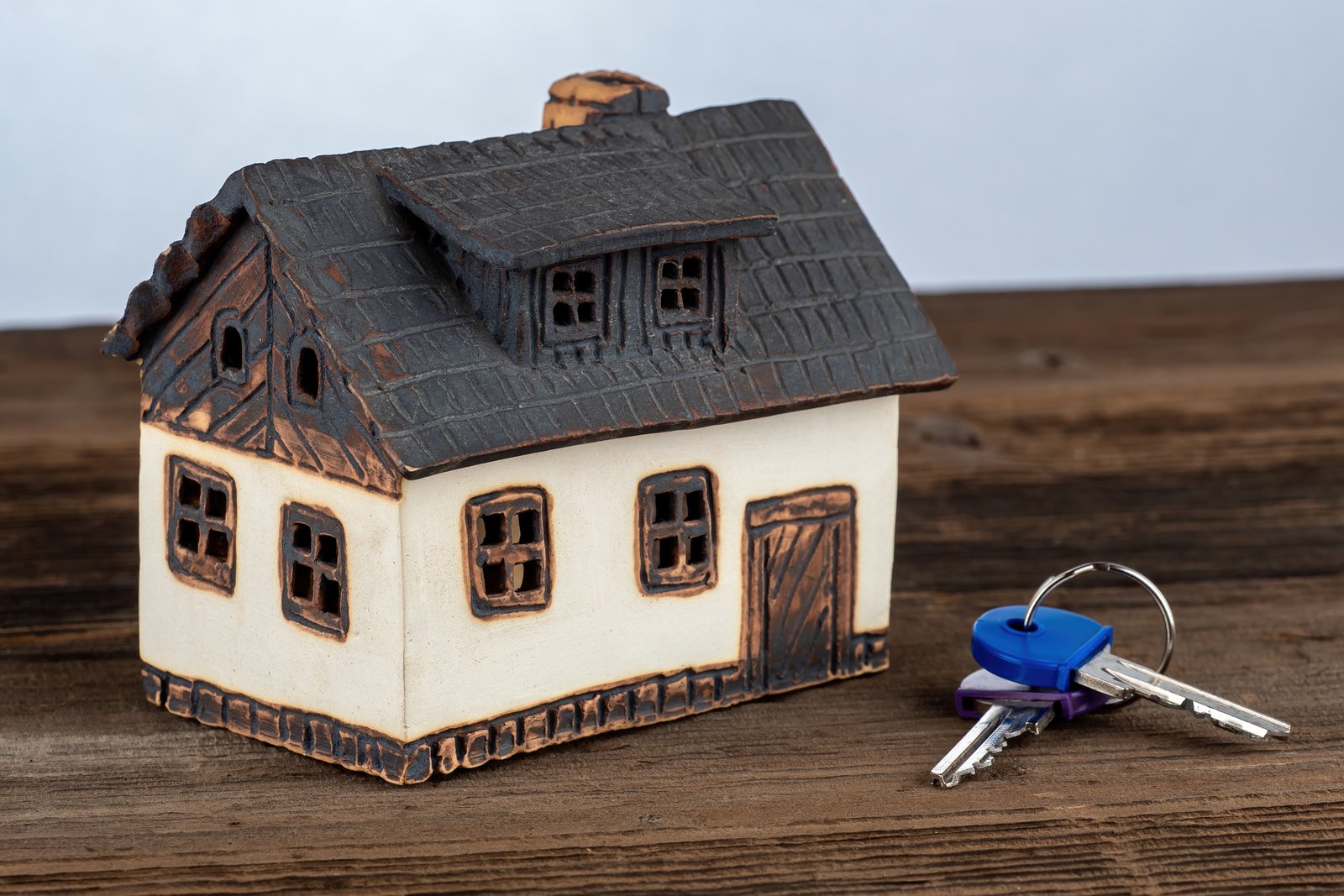 Real estate agent presenting a thoughtful closing gift to new homeowners