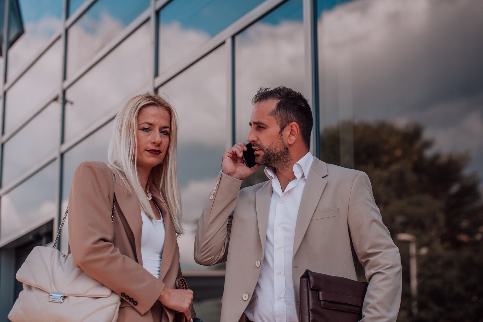 Realtor using WhatsApp Business app on smartphone with client