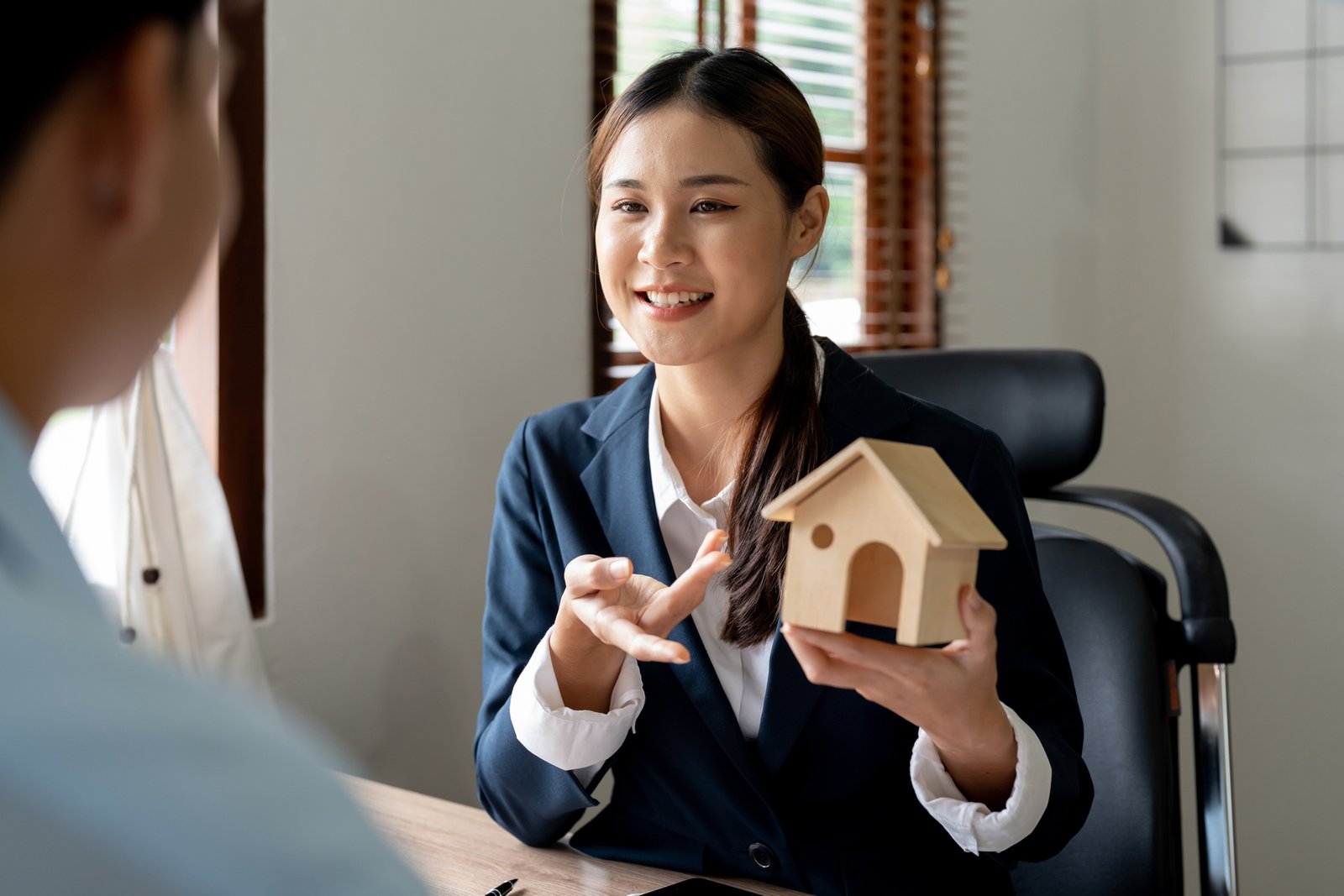LinkedIn profile for a real estate agent on a laptop screen