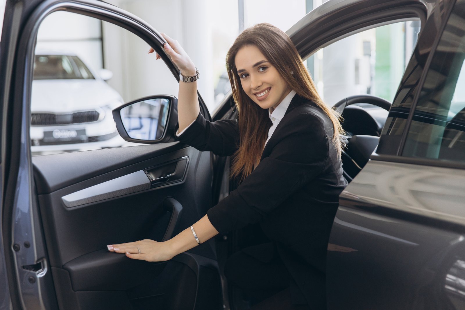 Real estate agent professional vehicle parked in front of a listing