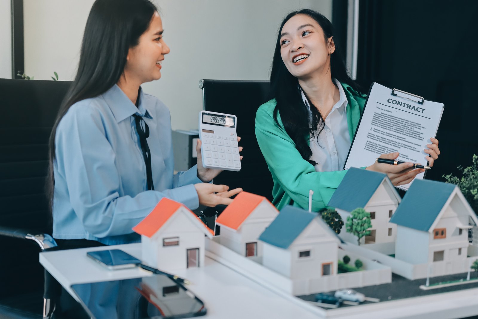 Canadian homeowner reviewing property tax assessment notice with a realtor