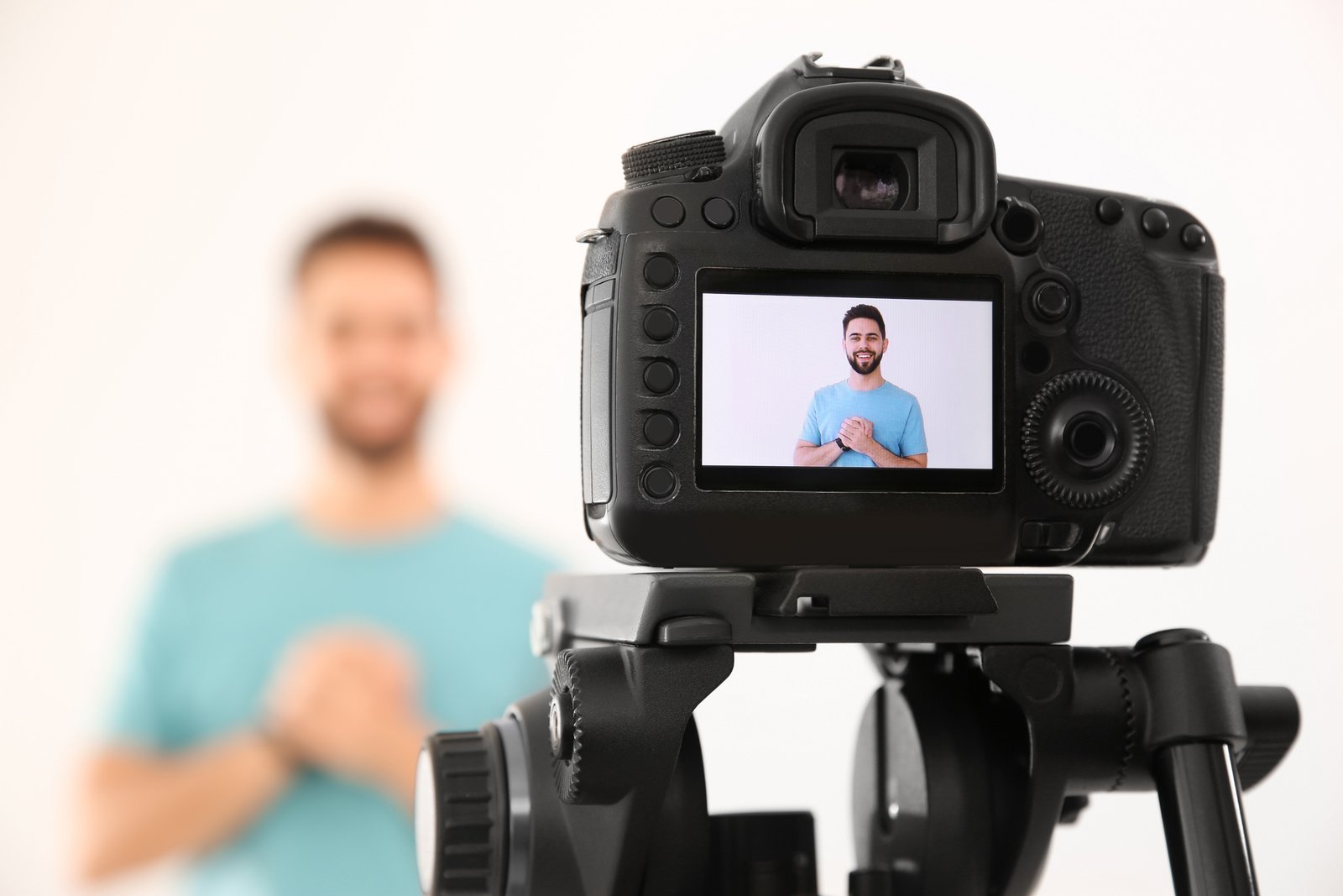 Real estate agent showing client testimonial video on phone at listing appointment